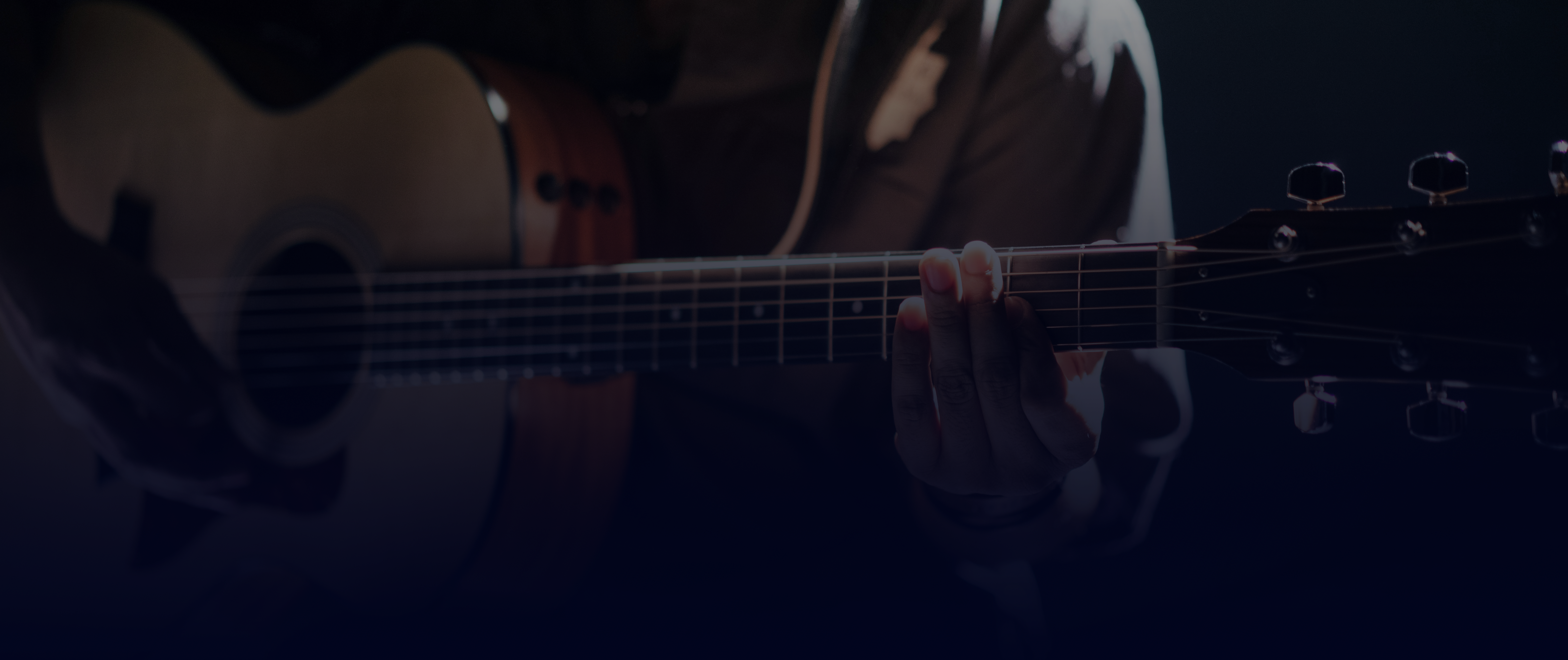 Guitar player holding a guitar